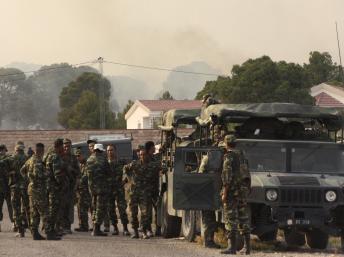 Des soldats tunisiens, à proximité de la frontière avec l’Algérie, lors de l’assaut donné sur le Mont Chaambi, le 2 août 2013. REUTERS